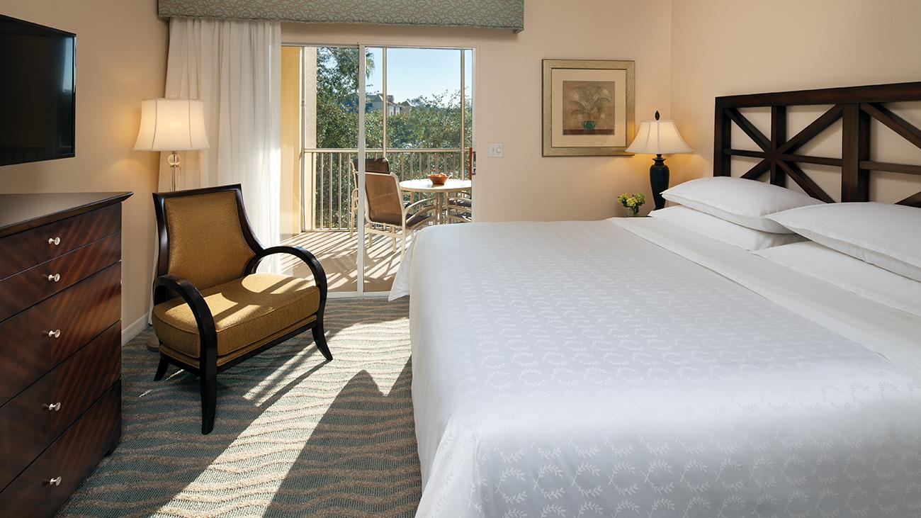 svr-cascades-one-bedroom-master-bedroom-with-balcony-interior-photo