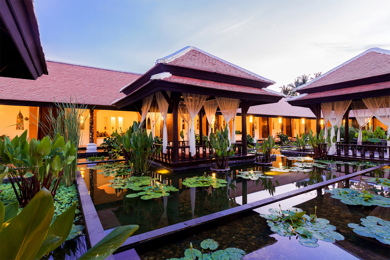 The entrance to the Quan Spa is surrounded by lush natural beauty.