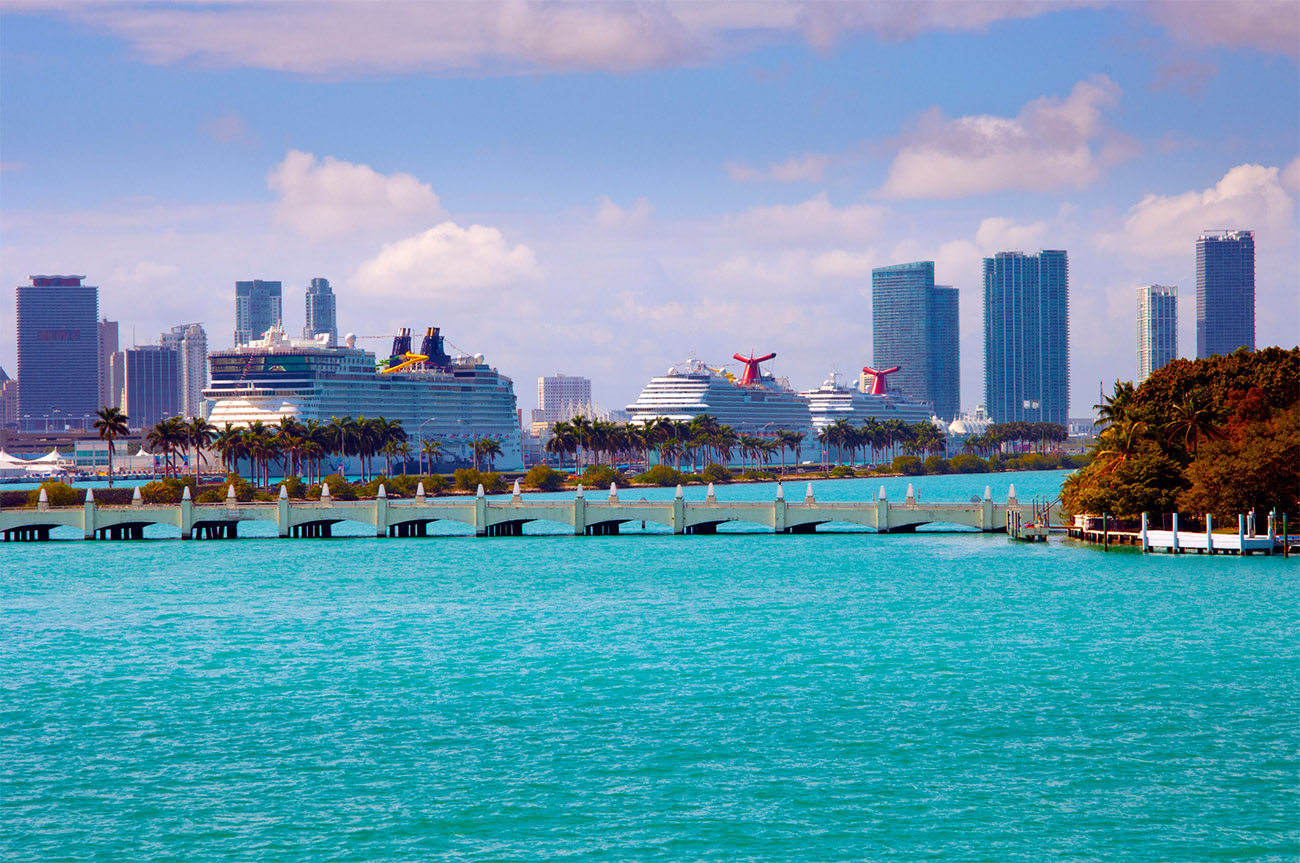 PortMiami with cruise ships in the port and bright blue water