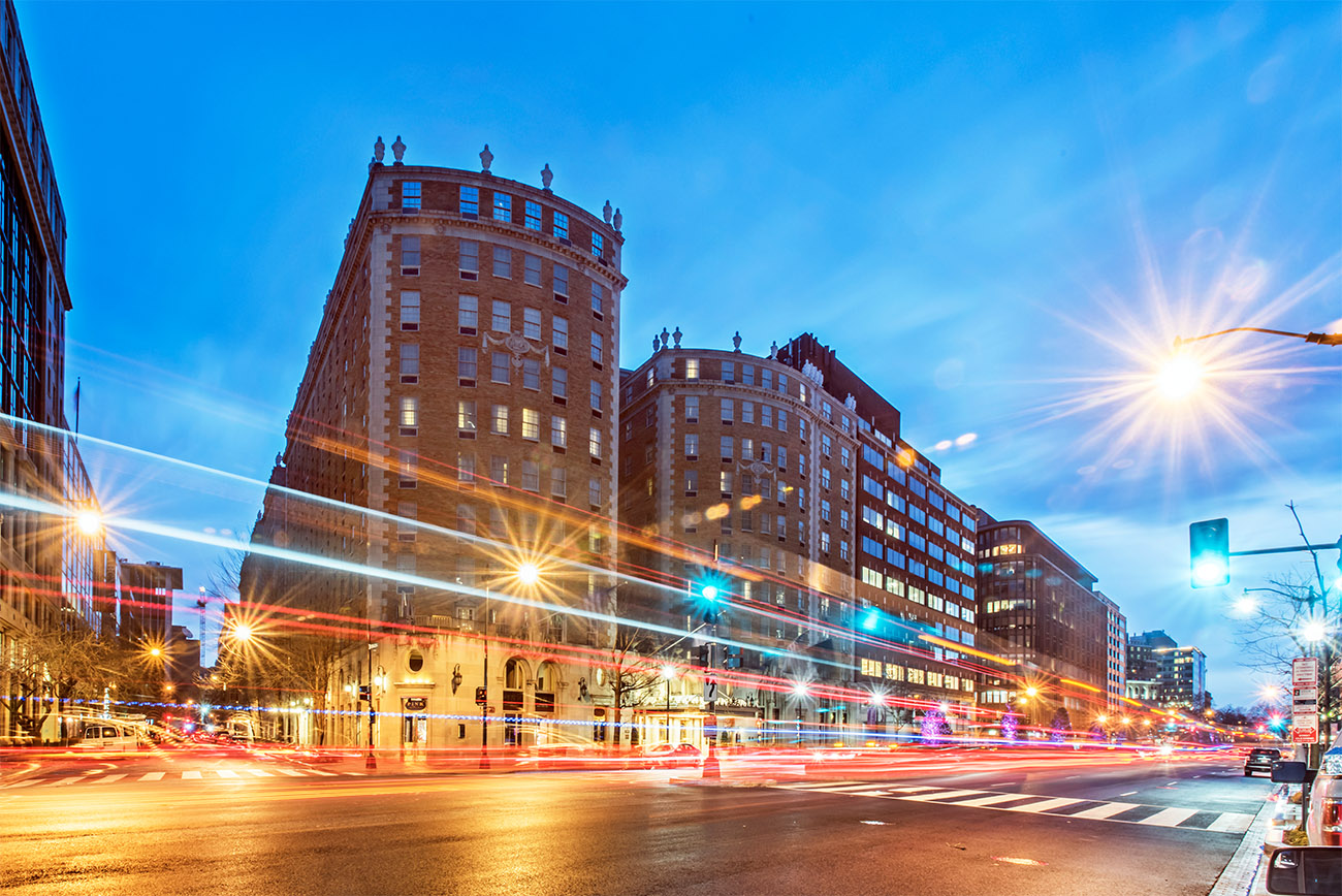 The Mayflower Hotel shines brightly as the sun begins to set.
