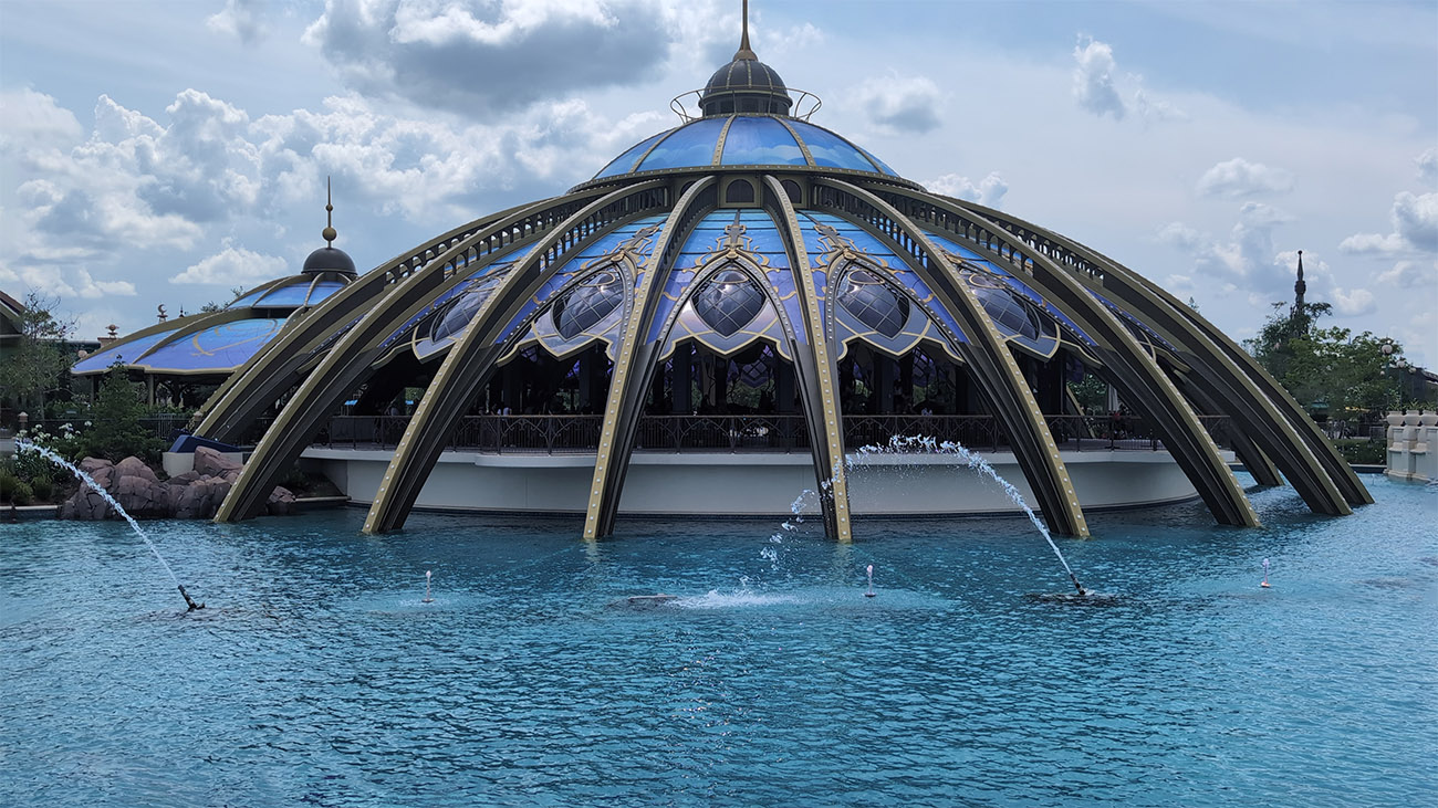 A domed building surrounded by water. 