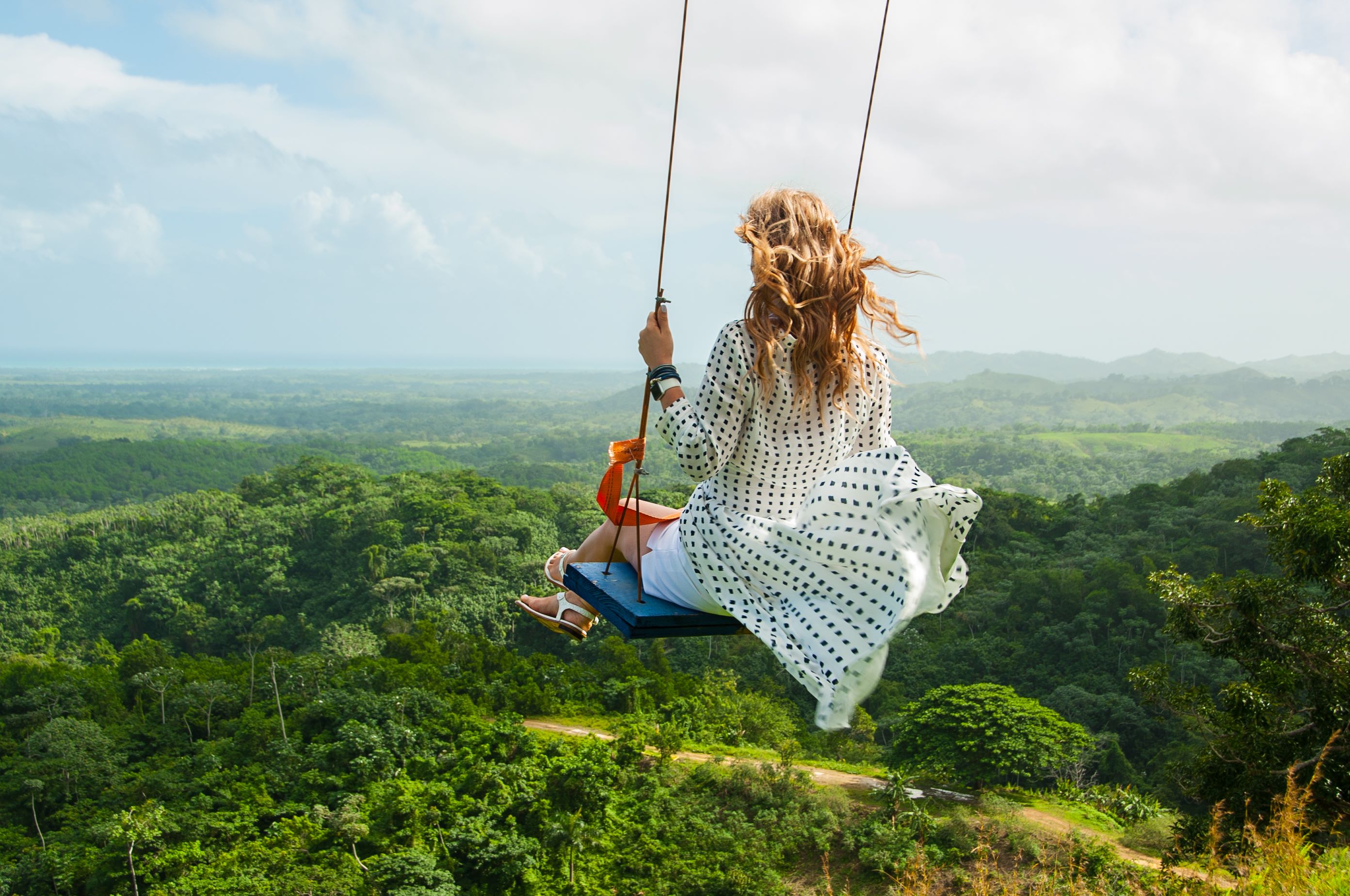 A woman on a scenic swing in Montaña Redonda. 