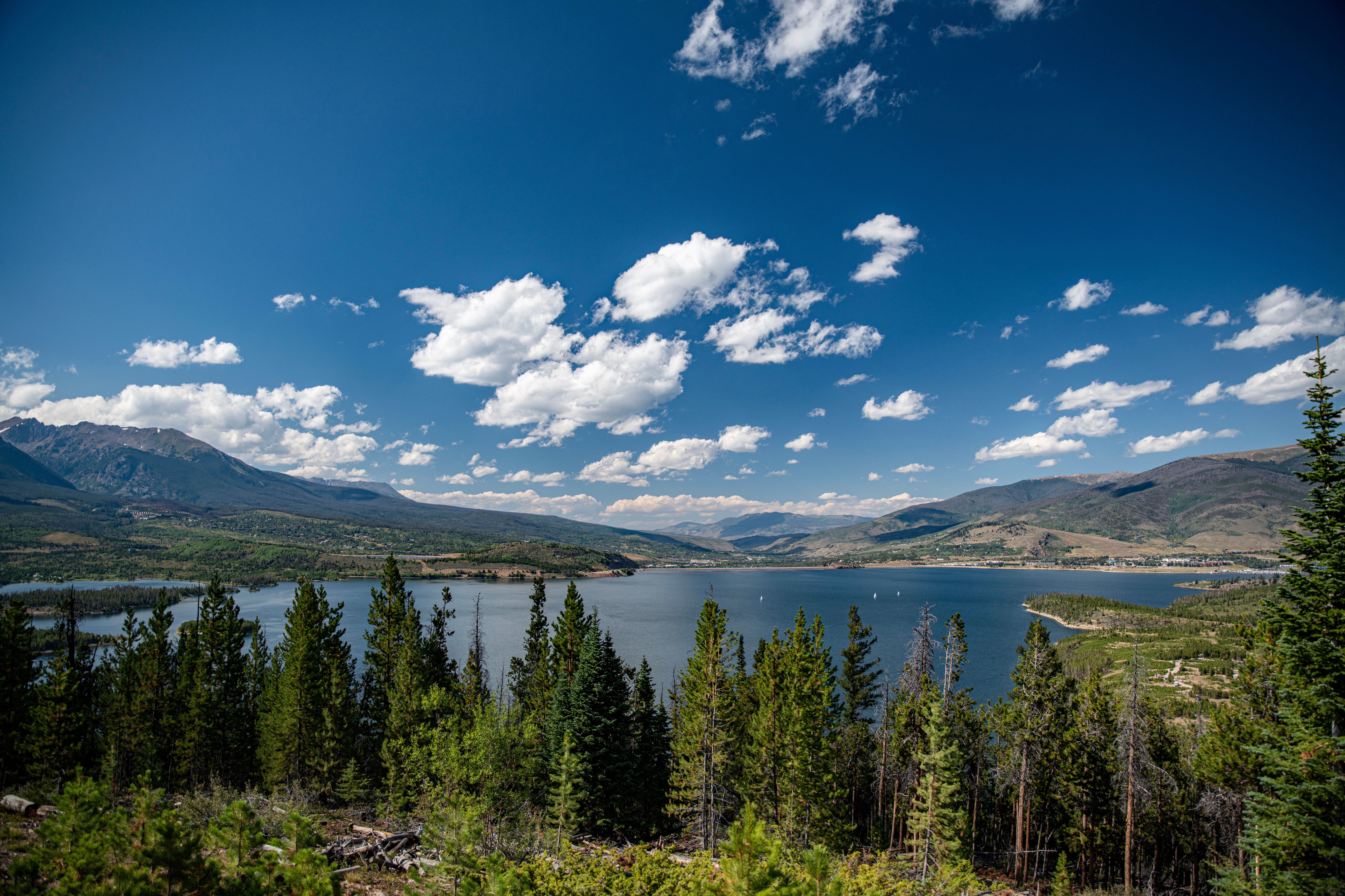 02.	A wide panoramic view of Lake Dillon, evergreen forests, and rolling hills. 